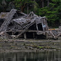 Burned down, fell over, then sank into the swamp